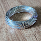 large sterling silver bangle made of 32 individual bangles interconnected
