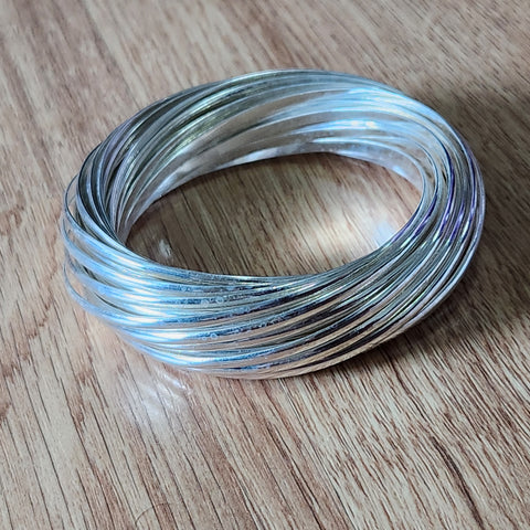 large sterling silver bangle made of 32 individual bangles interconnected