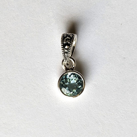 6 mm. bezel set blue topaz round stone with marcasite bale