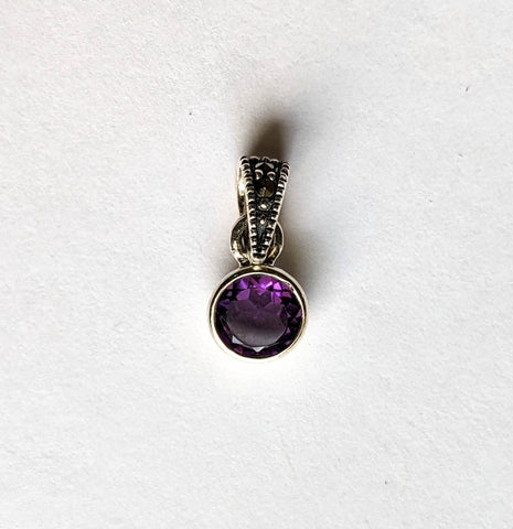 6 mm. round amethyst bezel set with marcasite bale