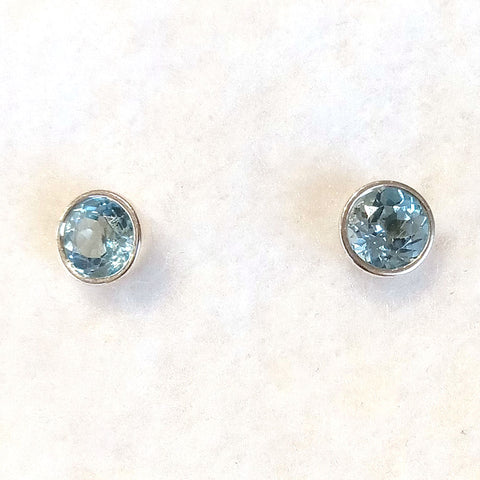 6 mm. blue topaz and sterling silver studs bezel set round stone