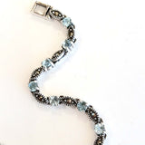 marc  17 * 3.5 mm. round blue topaz  with seed link bracelet