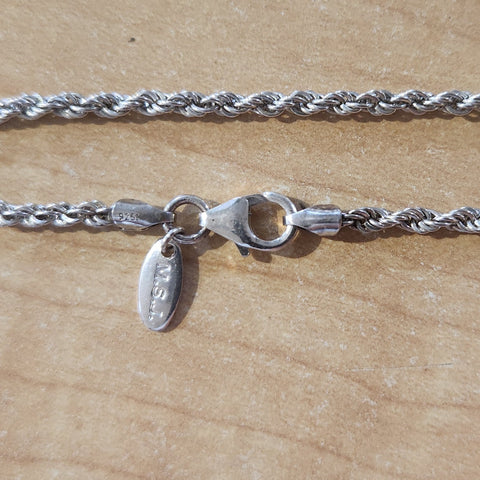close up of lobster claw clasp, endcaps, and "M.S.J" quality tag, "925" quality marks