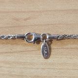close up of lobster claw clasp, endcaps, and "M.S.J" quality tag, "925" quality marks