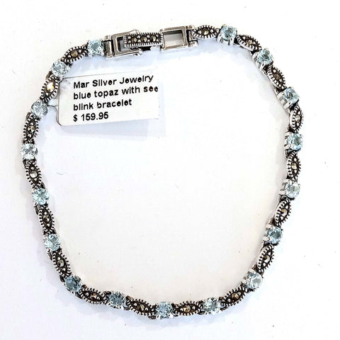 marc  17 * 3.5 mm. round blue topaz  with seed link bracelet
